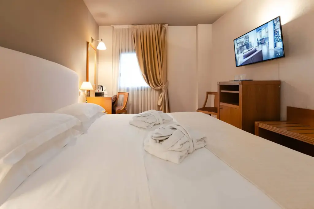 Camera accogliente e raffinata all'Hotel Touring